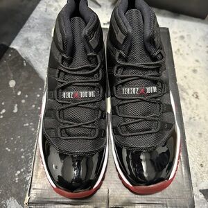 Jordan Black and Red Sneakers with Patent Leather 11s